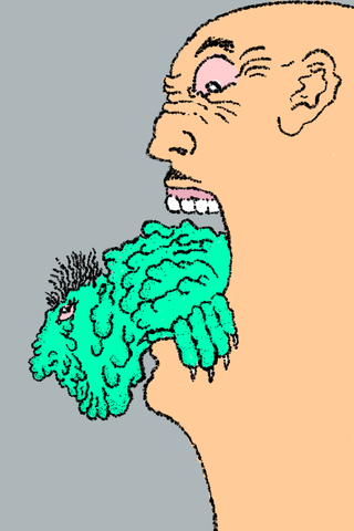 A bald man holds a small textured green creature between his open jaws.